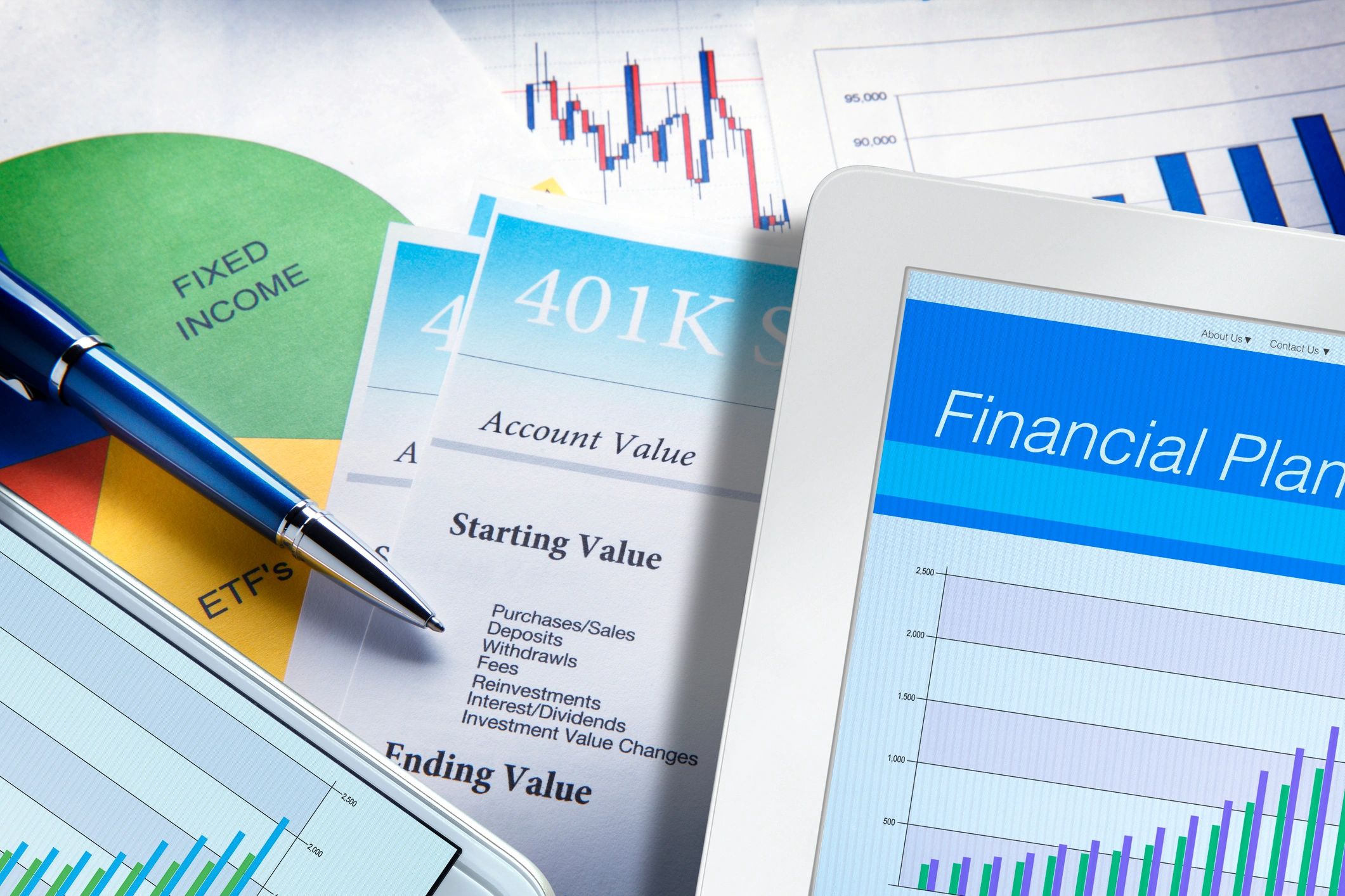 Digital financial plan displayed with documents on a desk