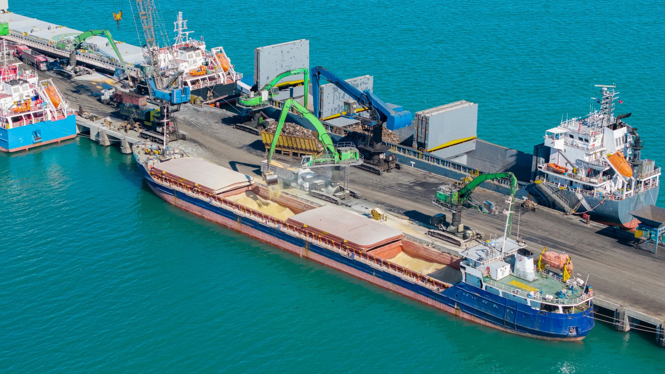 Cargo ship loading at industrial port