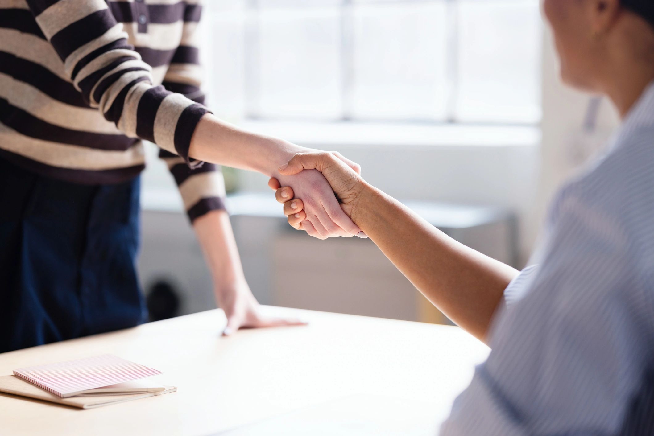 Business handshake representing trusted financial partnership