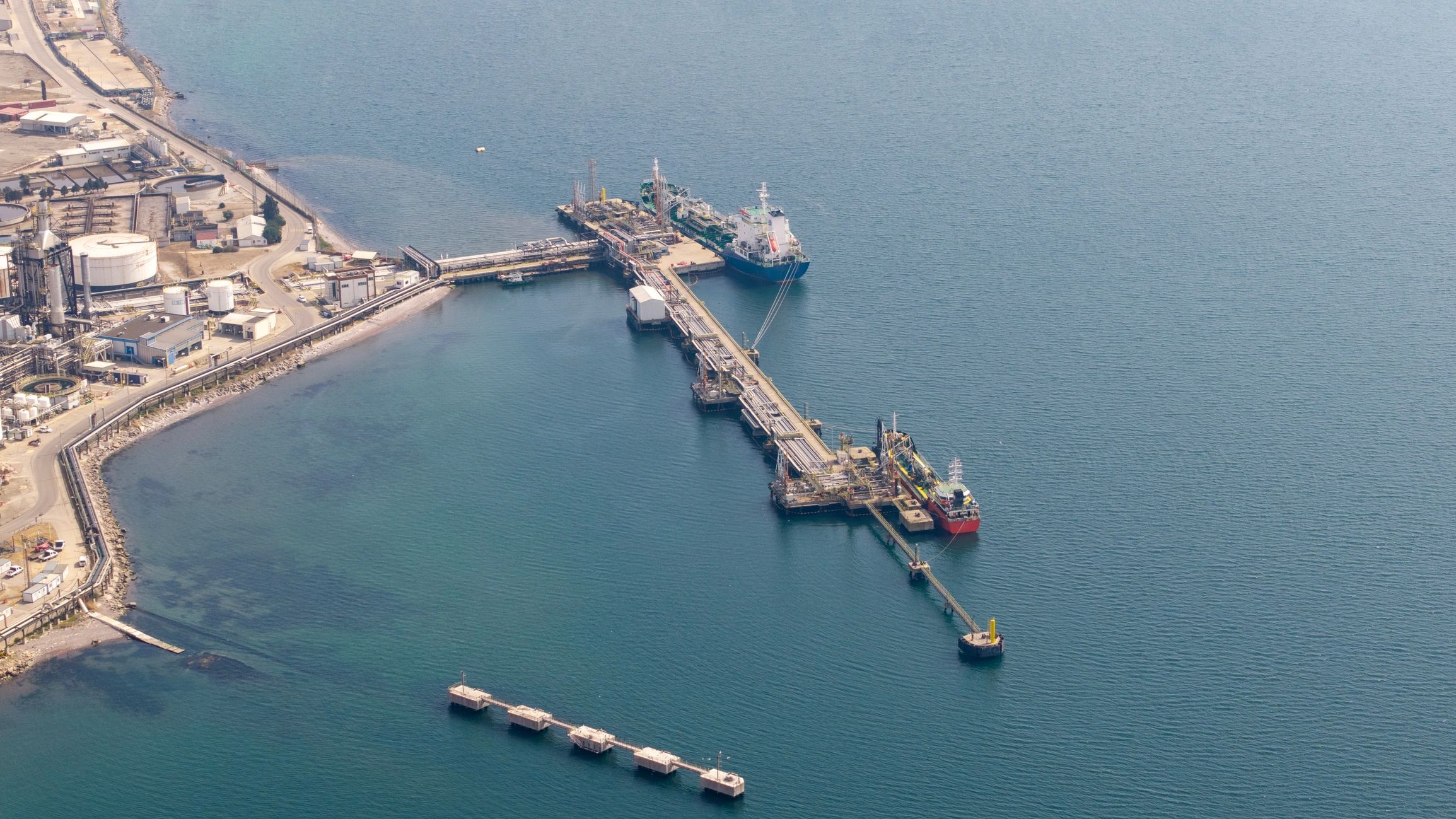 Industrial oil refinery port with cargo ships